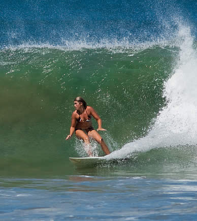 Girl surfing in Bocas del Toro, Panama
